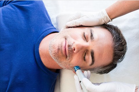 Male receiving HydraFacial in Day Spa